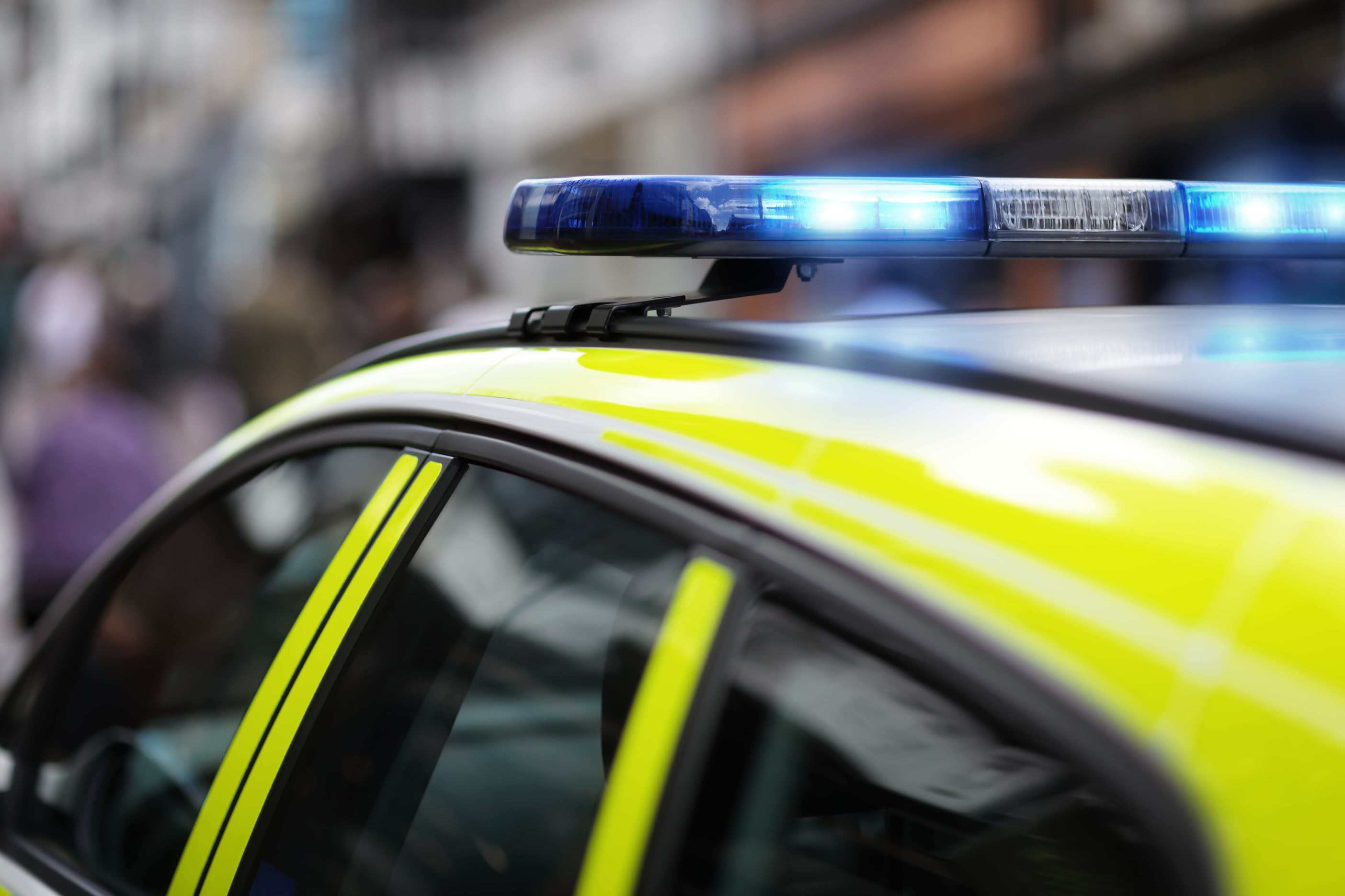 Top of a police car with siren lit